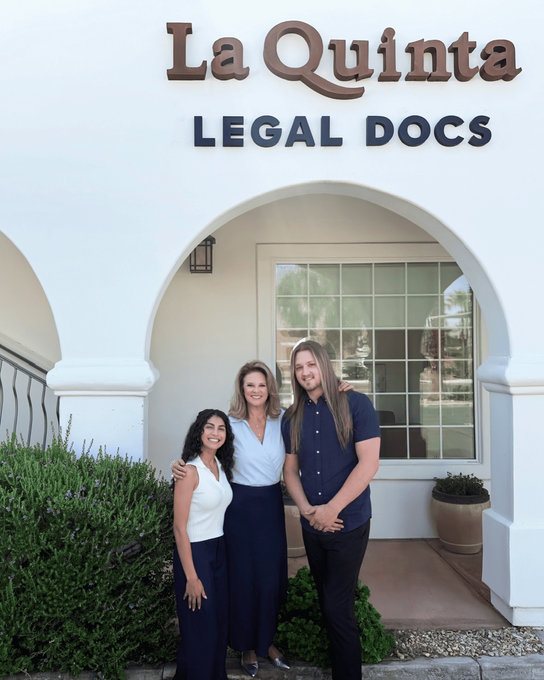 The La Quinta Legal Docs team at the office entrance